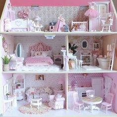 a doll house with furniture and accessories in it