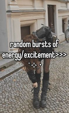 a woman walking down a cobblestone street with the words random bursts of energy / excitement