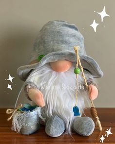 an old fashioned gnome is sitting on a table