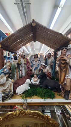 a nativity scene in a store filled with figurines