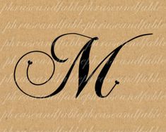 the letter m is made out of brown paper and has black ink on it's edges