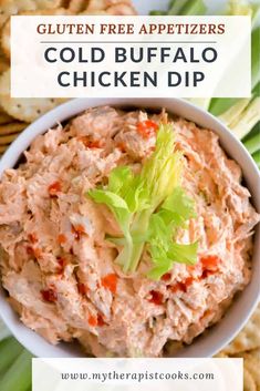 a white bowl filled with chicken dip and garnished with lettuce on top