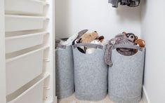 three grey bins with stuffed animals in them