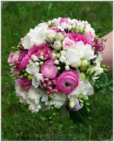 a bridal bouquet with pink and white flowers in the foreground is held by someone's hand