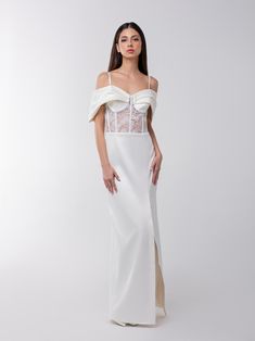 This meticulously tailored glamorous maxi dress is bolstered by its sheer lace exposed corsetry with flower embroidery, enhanced by internal boning, and its curve-hugging construction masterfully applied by Tia's artisan team.  Crafted from a luxurious satin fabric, it is accentuated by a sweetheart neckline, complemented by structured shoulder drape details for a touch of sophistication. Slim adjustable straps and an invisible zip at the back ensure a sleek, seamless appearance.  Complement this showstopping piece with a pair of strappy heels for an evening-ready look. Hand wash only. Wash inside out with like colours. Do not wring or twist. Do not tumble dry. Iron at 160°C max or use press cloth. Do not bleach. Professional dry clean. White Satin Overbust Corset Dress, Luxury White Satin Corset Dress, White Corset With Sheer Fitted Bodice, White Satin Corset, Luxury White Lace Bodice Corset, Dad Jewelry, Lace Corset, Stocking Fillers For Her, Satin Maxi