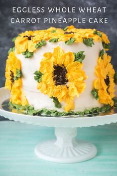 an eggless whole wheat carrot pineapple cake with sunflowers on the top