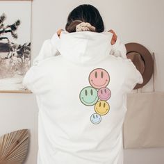 Time for a new Hoodie, and some new vibes! Pastel Smiley Face hooded sweatshirt  On trend, preppy Clean Girl aesthetic hoodie for school, lounging, or walking the beach enjoying the breeze. Exclusively designed by Parcel 23. Direct to garment printed in the USA (this is not a transfer, it's the real deal). Link for T-shirt option: https://www.etsy.com/listing/1548977185/oversized-comfort-colors-have-the-day Select your size and favorite color option, and we'll have it produced and delivered in a Playful Cotton Hoodie With Graphic Print, Playful Streetwear Hoodie, Fun Cotton Hoodie, Fun Cotton Hooded Hoodie, Fun Hoodie Sweatshirt With Drawstring Hood, Fun Hooded Sweatshirt For Streetwear, Fun Sweatshirt With Drawstring Hood, Playful White Hoodie With Drawstring Hood, Playful Hooded Hoodie For Streetwear