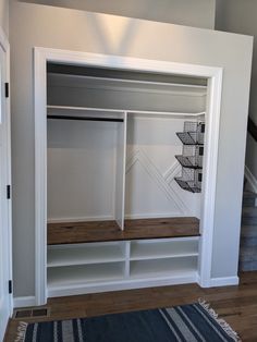 a white closet with shelves and drawers in it