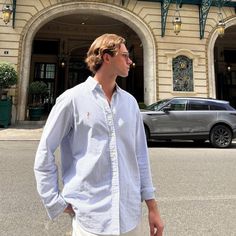 a man standing in front of a building