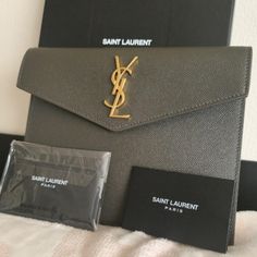 Brand New Full Inclusion Dimensions : 5".9h 7".9w 0".6 D Envelope Flap Top With Tonal Ysl Logo Gold Hardware. "Uptown": Made In Italy Grain De Poudre Leather Green Ysl Pouch Small Elegant Gray Wallets For Formal Occasions, Ysl Pouch, Bags Ysl, Ysl Logo, Yves Saint Laurent Bags, Small Pouch, Saint Laurent Paris, Small Pouches, 6 D