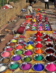 colorful powders are being sold at an outdoor market