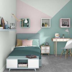 a room with a bed, desk and shelves on the wall is painted in pastel colors