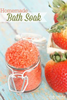 homemade bath soak with strawberries on the side and in a jar next to it