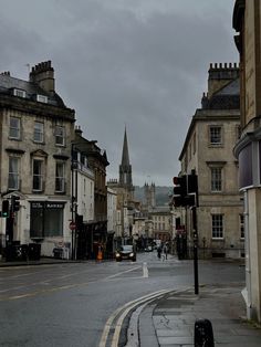 an empty city street with buildings on both sides