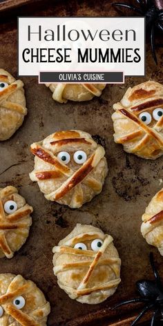 halloween cheese mummies on a baking sheet with googly eyes and spider webs