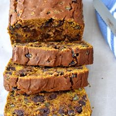 sliced loaf of pumpkin bread sitting on top of a table