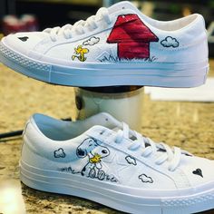 Custom painted Converse shoes inspired by Charlie Brown's Snoopy. All my shoes are painted with high quality acrylic paint and sprayed with a high gloss UV protectant. Custom requests are welcomed! All shoes are made to order please add a note to seller with the size you need in Men's or Woman's Snoopy Sneakers, Custom Painted Converse, Snoopy Shoes, Painted Converse, Purple Converse, Converse Low, Painted Sneakers, Converse Low Tops, Charlie Brown And Snoopy