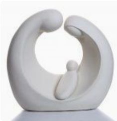 a white sculpture sitting on top of a table