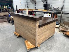 a wooden counter sitting inside of a garage