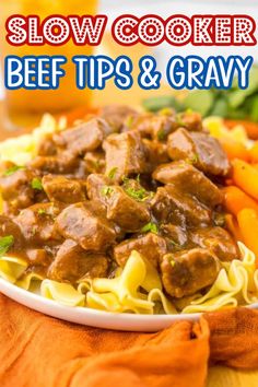 slow cooker beef tips and gravy on a plate with carrots