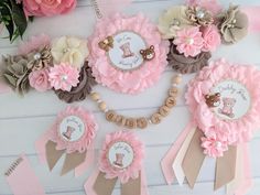 pink and brown baby shower decorations with teddy bear on it's nameplates