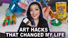 a woman holding a paintbrush in front of her face with the words art hacks that changed my life