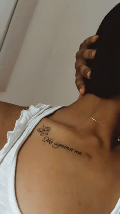 a woman with a tattoo on her back