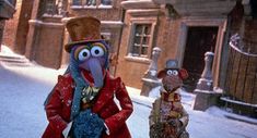 two cartoon characters are walking down the street in winter clothes, one is wearing a top hat and the other wears a red coat