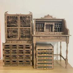 an old wooden desk with drawers and spider webs on the top, next to it