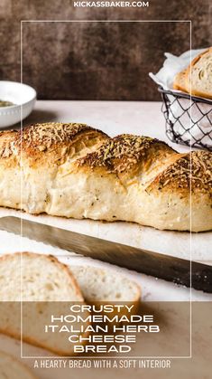 a loaf of bread sitting on top of a cutting board next to a knife and bowl