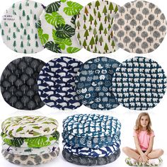 various patterns and sizes of round cushions with trees on the front, in different colors