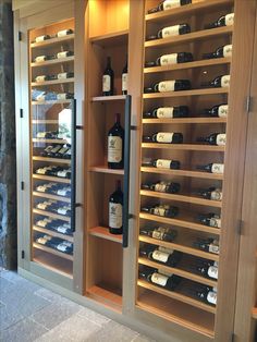 the wine cellar is stocked with many bottles