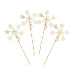 four white stars on top of each other with toothpicks in the shape of them