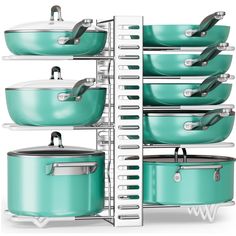 a stack of green pots and pans sitting next to each other