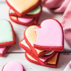 some heart shaped cookies are on a table