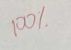 the word joy is written in red ink on a white paper with writing underneath it