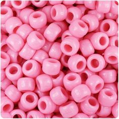 pink plastic beads with holes in the middle