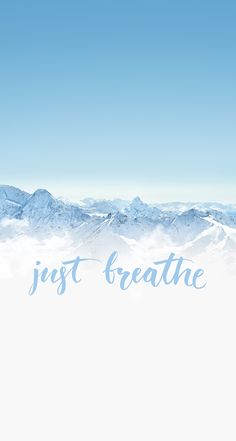 the words just breathe are in front of some snowy mountain tops with blue sky and clouds