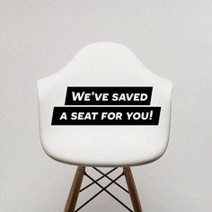 we've saved a seat for you sticker on a white chair