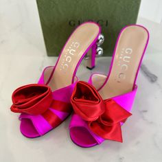 Brand New In Box. 100% Authentic Gucci Rose Ball Sandals Size 36 Style 699456 F1430 007 5680 Color- Pure Fuscia/ Rose Sandals By Gucci In Silk Satin With Rose Detail And Silver Spheres. - Gucci Love Parade Collection - Satin Rose On The Front - Silver Spheres With Gg Motif Applied On The Heel - Features Rounded Toe - Coated Stiletto Heel (9. 5cm) - Leather Sole - Made In Italy Comes Exactly As Shown In Photos. Includes Box, Dustbags And Papers Elegant Red Gucci Sandals, Luxury Pink Sandals With Wrapped Heel, Luxury Pink Sandals With Padded Heel, Luxury Pink High Heel Sandals, Pink Luxury Sandals For Formal Occasions, Luxury Pink Heels For Summer, Gucci Pink Open Toe Sandals, Designer Pink Sandals With Wrapped Heel, Gucci Sandals With Branded Heel Counter For Party