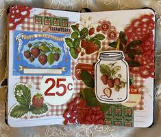 an open book with strawberrys on the cover and numbers in red, white and blue