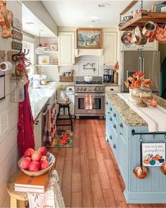 a kitchen filled with lots of appliances and counter top space next to a wooden floor