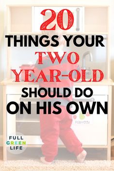 a toddler standing in front of a cabinet with the words 20 things your two year - old should do on his own