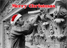 a black and white photo of a man wearing a santa hat on top of a building