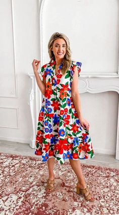 Experience the breathtaking beauty of this midi dress! Its striking floral print showcases a captivating blend of boldness and vibrant colors that will steal your heart. This dress is an absolute must-have for the delightful seasons of spring and summer, ensuring endless fun-filled moments. With its side zipper, short ruffled sleeves, and high split neck, this midi dress is both stylish and convenient. The bold floral print adds a touch of elegance, while the tiered body adds a playful flair. Cr Multicolor Floral Print Dress, Cheap Multicolor Shift Midi Dress, Cheap Multicolor Dresses For Brunch, Luxury Multicolor Floral Dress For Summer, Cheap Fitted Multicolor Floral Dress, Cheap Chic Multicolor Dresses, Luxury Multicolor Floral Dress For Women, Affordable Non-stretch Multicolor Dresses, Playful Cheap Fitted Dresses