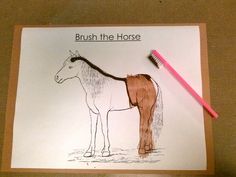 a drawing of a horse and a toothbrush on top of a piece of paper