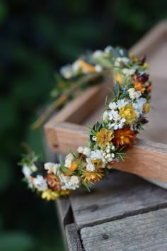 a flower crown sitting on top of a wooden box