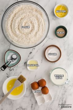 ingredients to make an egg muffin laid out on a marble counter top