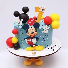 a mickey mouse birthday cake on a plate