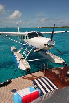 a small plane is parked on the water